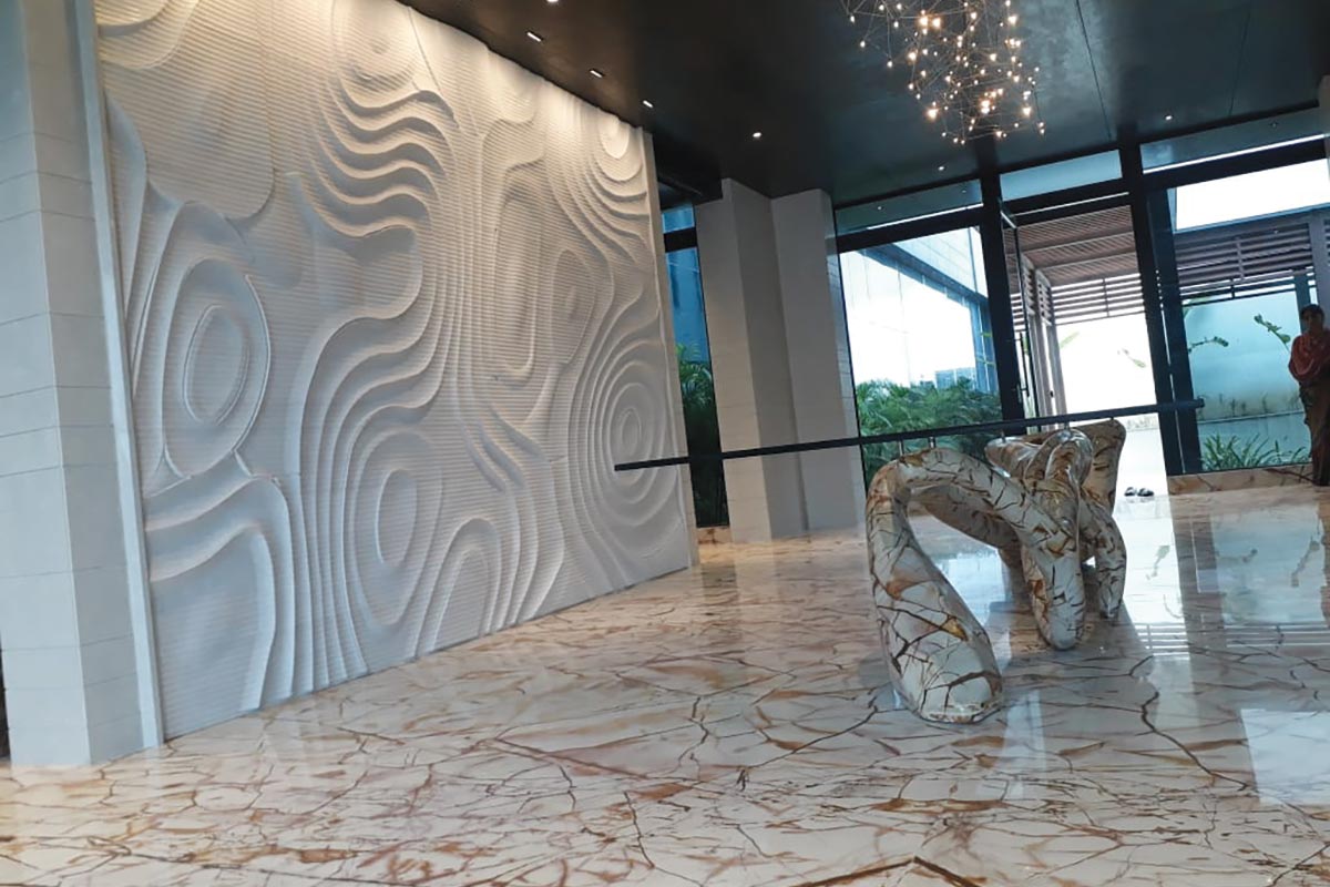 Sculptural columns in marble and single slab KalingaStone quartz top discussion table