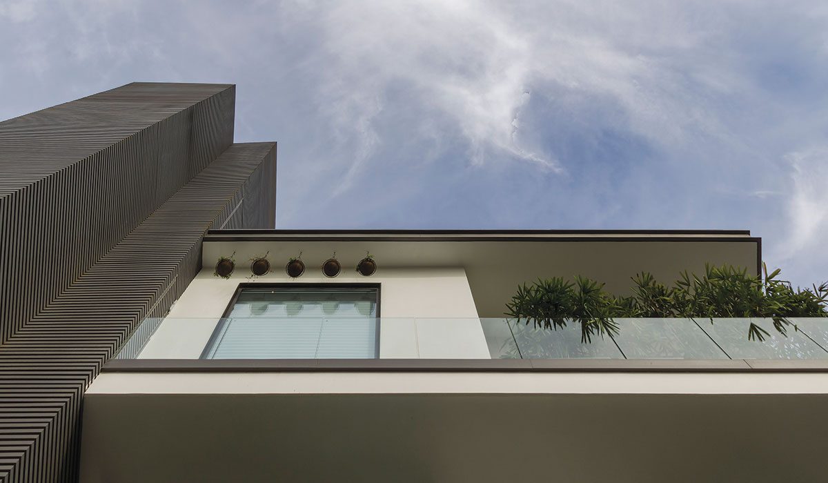 house with robust attributes and voluminous light-filled living spaces