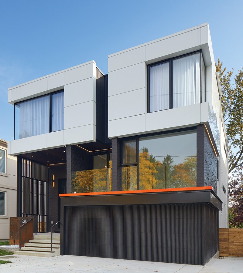Predominantly wrapped in black bricks and floor-to-ceiling glazing