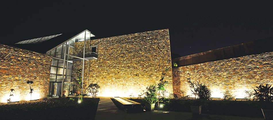 Night Shot - juxtaposed walls mark the entrance