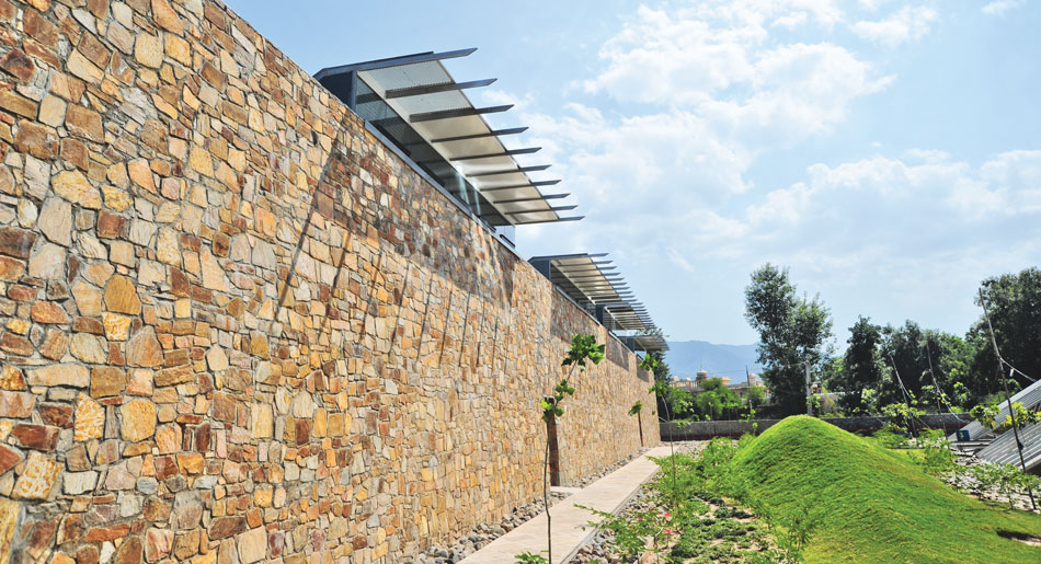 complete 1 rubble masonry walls shield the lightweight steel roofs a strong contrast
