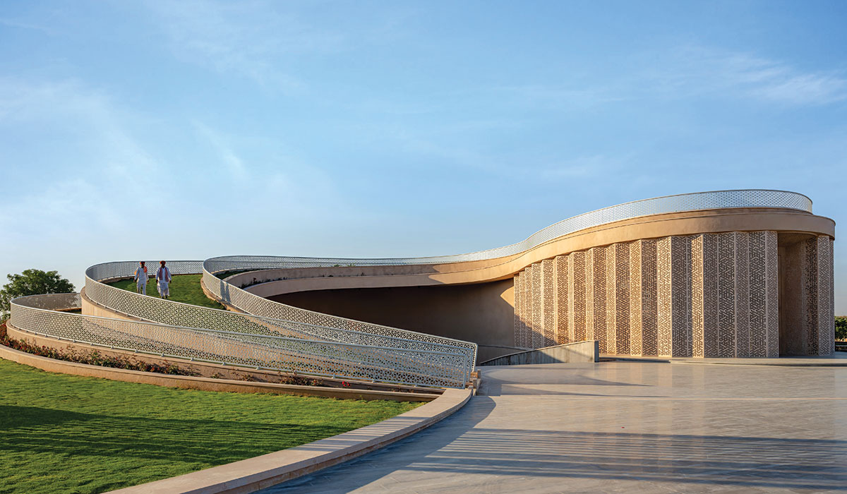 the structure’s sweeping curvilinear volume rises up