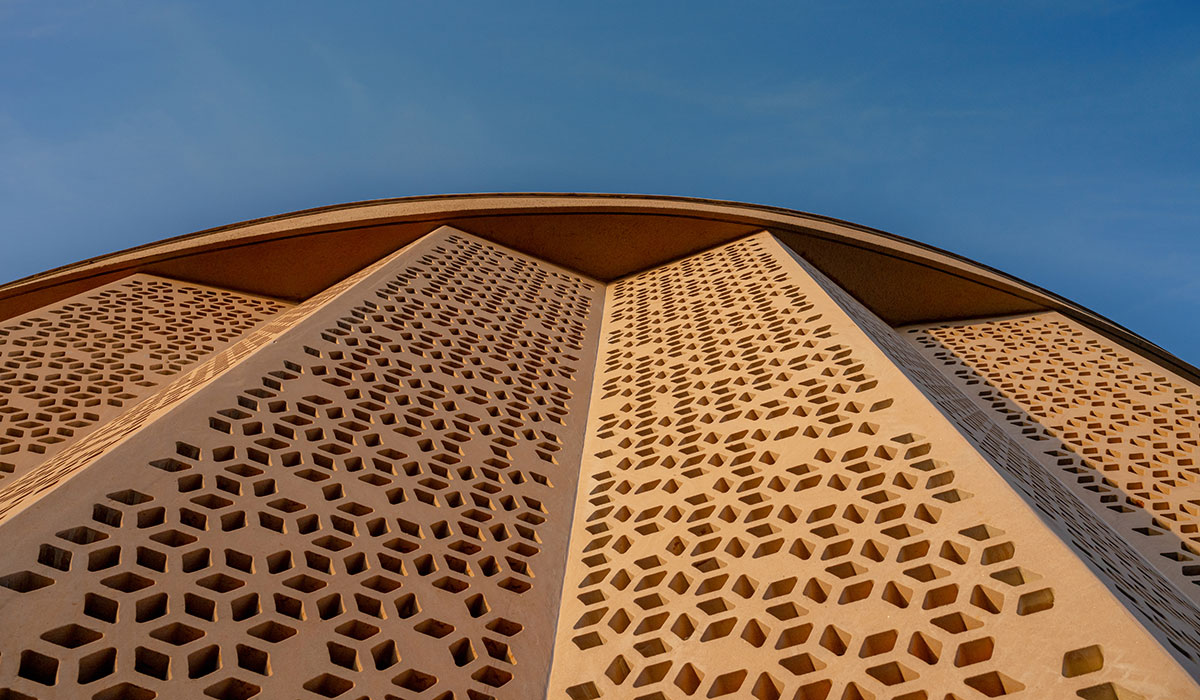 the structure’s sweeping curvilinear volume rises up